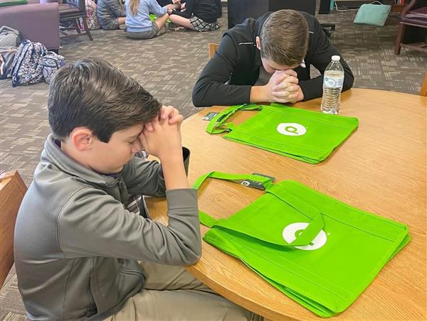 Whitesburg Students Pray over Donation Bags